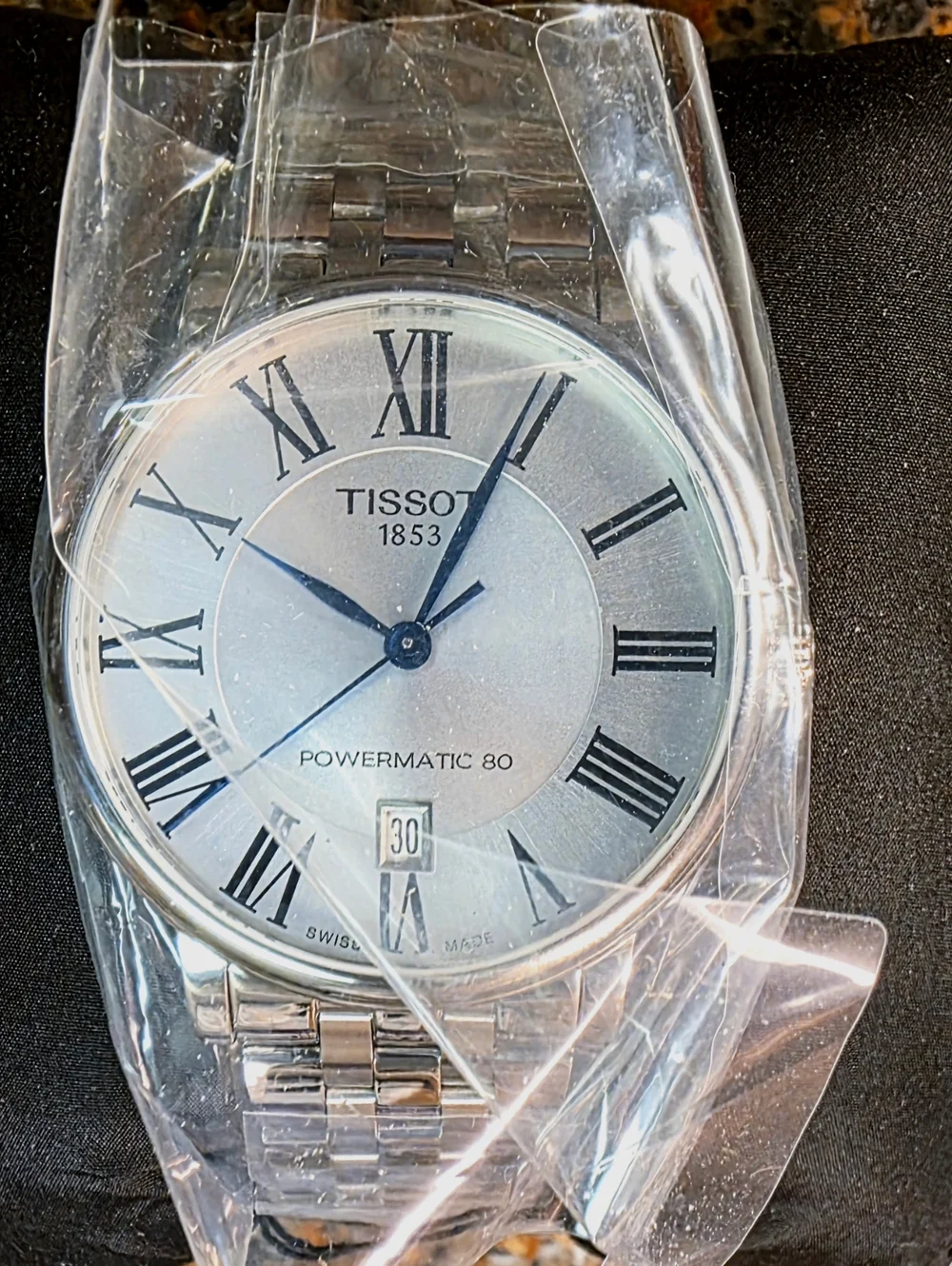 Tissot Silver Watch with Blue Hands and White Dial